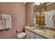 This cozy bathroom features granite counters, a tile backsplash and shower, and modern fixtures at 633 Rolling Springs Dr, Cary, NC 27519