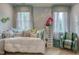 This charming bedroom features a cozy daybed, soft colors, and stylish accents for a relaxing retreat at 633 Rolling Springs Dr, Cary, NC 27519