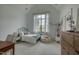 Bright bedroom with a cozy bed, large window, and a built-in bookshelf at 633 Rolling Springs Dr, Cary, NC 27519