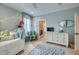 Cozy bedroom featuring a comfortable daybed, dresser, and a view into the attached bath at 633 Rolling Springs Dr, Cary, NC 27519