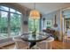Inviting breakfast nook with views of nature, a round table, and bright light at 633 Rolling Springs Dr, Cary, NC 27519