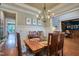 Formal dining room boasting a wooden table, wainscoting, and view into the office at 633 Rolling Springs Dr, Cary, NC 27519