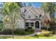 Charming two-story home with stone accents, manicured lawn, and a welcoming front porch at 633 Rolling Springs Dr, Cary, NC 27519