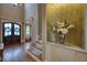 Welcoming foyer with staircase, featuring views of formal living and dining spaces at 633 Rolling Springs Dr, Cary, NC 27519