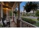 Charming front porch with stone columns and fern hangings, perfect for enjoying neighborhood views at 633 Rolling Springs Dr, Cary, NC 27519