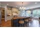 Well-equipped kitchen featuring custom cabinets, a center island, and pendant lighting at 633 Rolling Springs Dr, Cary, NC 27519