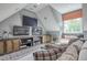 Spacious living room with a built in entertainment center, 3 TV's and a comfortable window seat at 633 Rolling Springs Dr, Cary, NC 27519