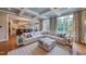 Open-concept living room flows into a modern kitchen, complete with hardwood floors and ample natural light at 633 Rolling Springs Dr, Cary, NC 27519