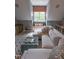 Bright and airy living room featuring a window seat, large sofa, and stylish decor at 633 Rolling Springs Dr, Cary, NC 27519