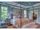 Elegant bedroom showcasing a four-poster bed, soft lighting, and a bright, airy atmosphere at 633 Rolling Springs Dr, Cary, NC 27519