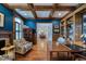 Bright office with coffered ceilings, hardwood floors, custom built-ins, fireplace, and blue walls at 633 Rolling Springs Dr, Cary, NC 27519