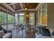 Inviting screened-in patio with comfortable seating and wood ceiling at 633 Rolling Springs Dr, Cary, NC 27519