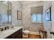 Refined powder room with ornate wallpaper, marble countertop, and elegant fixtures at 633 Rolling Springs Dr, Cary, NC 27519