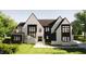 Charming two-story home with a striking modern design, multiple windows, and fresh landscaping at 6908 Bent Pine Pl, Raleigh, NC 27615
