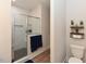 Modern bathroom featuring a glass-enclosed shower, stylish vanity, and decorative shelves at 710 Country Rd, Middlesex, NC 27557