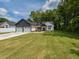 Charming single-Gathering home with a well-manicured lawn and a three-car garage at 710 Country Rd, Middlesex, NC 27557