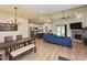 Open concept living room with a fireplace, dining area, and kitchen at 710 Country Rd, Middlesex, NC 27557