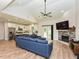 Open concept living room with a fireplace, dining area, and kitchen at 710 Country Rd, Middlesex, NC 27557