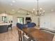 Open concept living area joining kitchen and dining with fireplace, tv and access to outdoor patio at 710 Country Rd, Middlesex, NC 27557