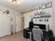 Home office featuring a desk, gaming chair, wall decor, and hardwood floors at 710 Country Rd, Middlesex, NC 27557