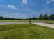 View from the driveway of a home with country views at 710 Country Rd, Middlesex, NC 27557
