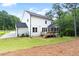 Exterior of the home featuring a back deck, screened porch, and spacious backyard at 720 The Parks Dr, Pittsboro, NC 27312
