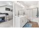 Hall bathroom with double sink vanity, attractive lighting, and shower/tub combo at 720 The Parks Dr, Pittsboro, NC 27312