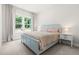 Serene bedroom with large window providing ample natural light at 720 The Parks Dr, Pittsboro, NC 27312