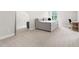 Bedroom area with a comfortable daybed, large mirror, and view of the window at 720 The Parks Dr, Pittsboro, NC 27312