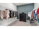 Spacious walk-in closet with custom shelving and dark wood dresser at 720 The Parks Dr, Pittsboro, NC 27312