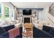 Comfortable living room featuring a fireplace, built-in shelving, and a calming color palette at 720 The Parks Dr, Pittsboro, NC 27312