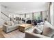Open concept living room with the kitchen in the background at 720 The Parks Dr, Pittsboro, NC 27312