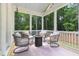 Cozy screened porch with comfortable seating and a beautiful outdoor view at 720 The Parks Dr, Pittsboro, NC 27312