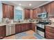 Well-equipped kitchen boasts stainless steel appliances, granite countertops, and ample cabinet space at 7502 Hedfield Way, Durham, NC 27713