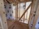 Unfinished bathroom showing wood framing, plastic sheeting and plumbing at 76 Tuskeegee Dr, Smithfield, NC 27577