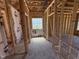 Bathroom framing showcasing window placement and plumbing, visualizing the future functional space at 76 Tuskeegee Dr, Smithfield, NC 27577