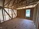 Unfinished bedroom showing a window for natural light and wood frame construction at 76 Tuskeegee Dr, Smithfield, NC 27577