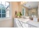 Well-lit bathroom showcasing a vanity with a sink, a large mirror, and a glass-enclosed shower at 7713 Summercrest Dr, Apex, NC 27539