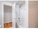 Bright bathroom with white subway tile in the shower and tiled floors, next to the bedroom at 7713 Summercrest Dr, Apex, NC 27539