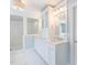 Luxurious bathroom features marble floors, double vanity, and a glass enclosed shower at 7713 Summercrest Dr, Apex, NC 27539