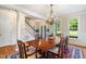 Chandelier-lit dining room with large windows and direct access to the main entrance at 7713 Summercrest Dr, Apex, NC 27539