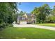 Beautiful brick two-story home with attached garage and lush lawn at 7713 Summercrest Dr, Apex, NC 27539