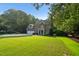 Charming two-story brick house with attached garage and a manicured front lawn at 7713 Summercrest Dr, Apex, NC 27539