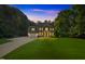 Stunning two-story brick home with manicured lawn and attached garage at 7713 Summercrest Dr, Apex, NC 27539