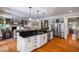 Bright kitchen features stainless appliances, granite countertops, and hardwood flooring at 7713 Summercrest Dr, Apex, NC 27539