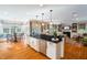 Open-concept kitchen and breakfast bar with great views to the dining and living room at 7713 Summercrest Dr, Apex, NC 27539