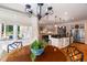 Kitchen view from breakfast nook showing stainless appliances and hardwood floors at 7713 Summercrest Dr, Apex, NC 27539