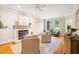 Cozy living room showcases a fireplace, hardwood floors and natural light at 7713 Summercrest Dr, Apex, NC 27539