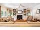 Cozy living room features a fireplace, built-in shelving, and comfortable seating at 7713 Summercrest Dr, Apex, NC 27539