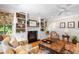 Living room with fireplace, built-in shelving, and comfortable seating at 7713 Summercrest Dr, Apex, NC 27539
